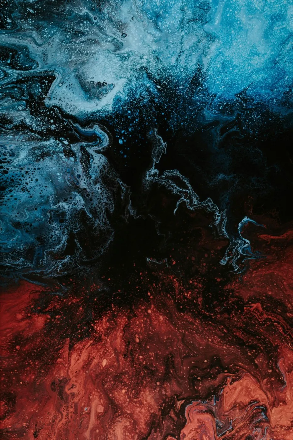 Abstract swirl of deep blue and red, evoking heat and cold